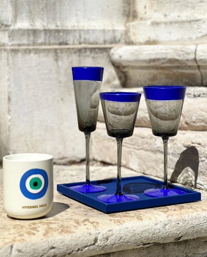 Composition of glasses, cup and tray set in Venice