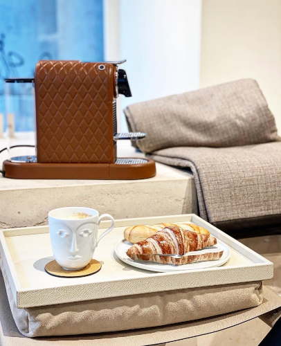 Composition set indoors with breakfast tray and coffee machine, items by Giobagnara Venezia